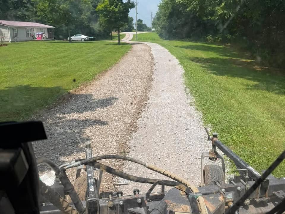 A drive rebuilt, rolled and shaped to shed water by K&M Property Maintenance — Northern Kentucky