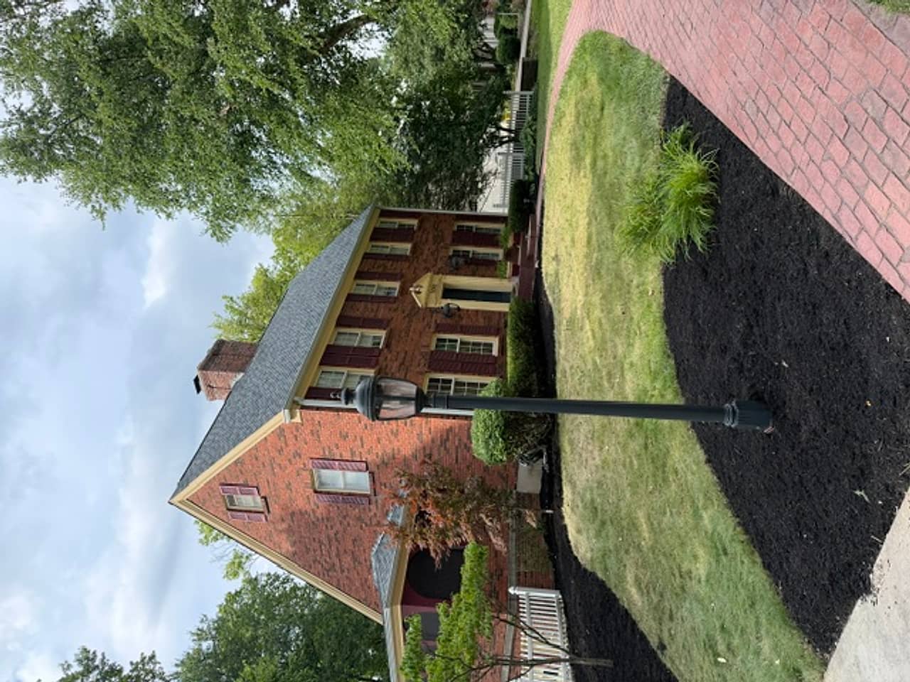 Fresh beds and mulch along a brick walkway by K&M Property Maintenance — Northern Kentucky